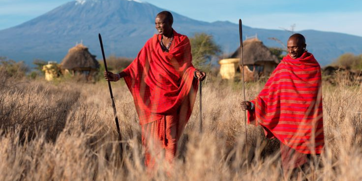 Maasai warriors with Mount Kilimanjaro backdrop