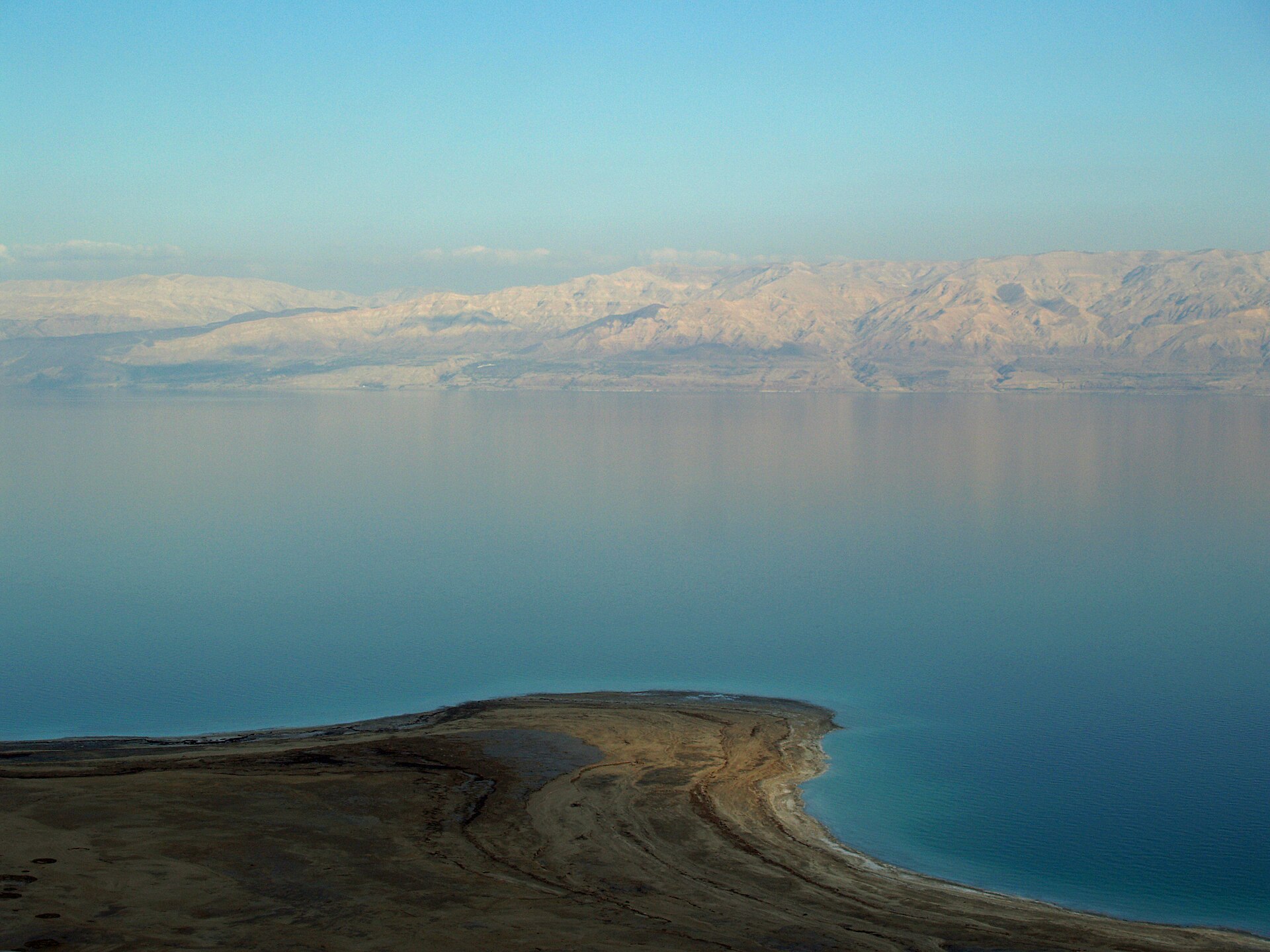 The Dead Sea shoreline with the Moab mountains beyond